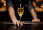 Close-shot-of-glass-with-sparkling-wine-in-the-bartender's-hands-1149484170_4117x2740
